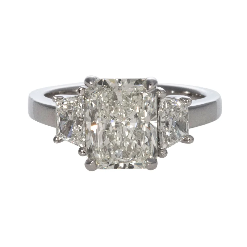 Five-stone ring-3ct Radiant & .71ct Trapezoid Side Diamond Three-Stone Platinum Ring