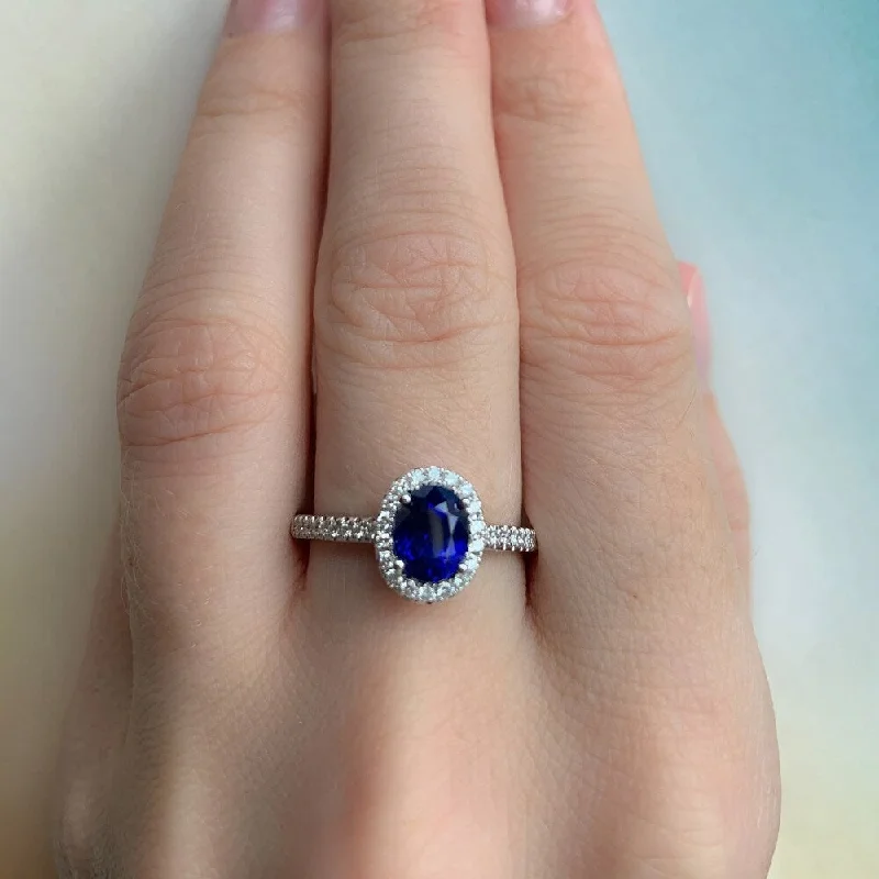 Hollowed-out ring-Miadora 14k White Gold Oval-Cut Blue Sapphire and 1/5ct TDW Diamond Halo Engagement Ring